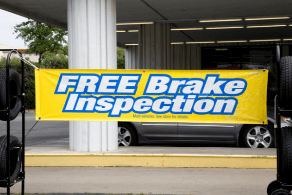 The image shows a yellow banner that reads: FREE Brake Inspection