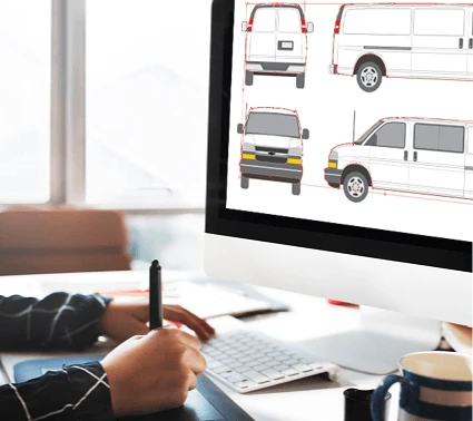 Image of a person working with a car architect, looking at a laptop screen