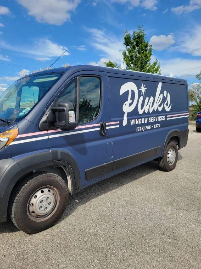 blue color van with "Pink's window service" written on it